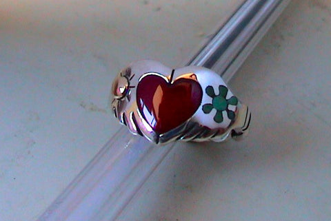 Sterling Silver Claddagh ring has a Coral Heart with a 14k gold and inlay. The ring is designed and handmade by Ron Henry, Navajo silversmith.
